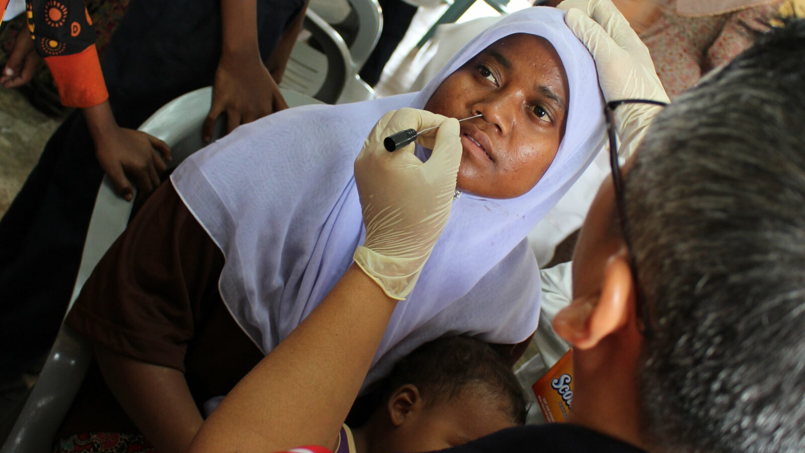 woman having nasal swab test