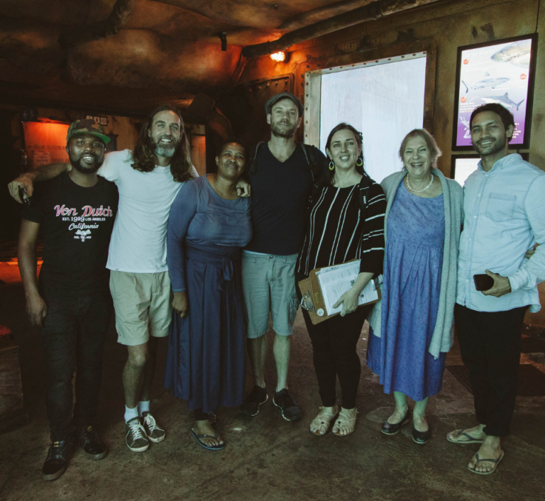 Left to right: Empatheatre team Zenzo Msomi, Dylan McGarry, Mpume Mthombeni, Neil Coppen, Kira Erwin, Alison Cassels and Roy Booth at a post-show performance at the Durban Aquarium in South Africa.